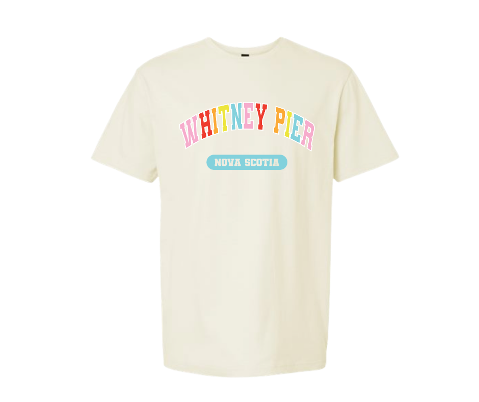 An off-white short-sleeve crewneck t-shirt featuring a colorful graphic on the chest that reads 'WHITNEY PIER' in multicolored letters and 'NOVA SCOTIA' in a light blue banner below it, displayed on a solid white background.