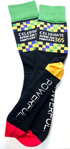  Sock that reads "Celebrate African Heritage 365" with Powerful logo on bottom. Red toes, yellow heel and green top.